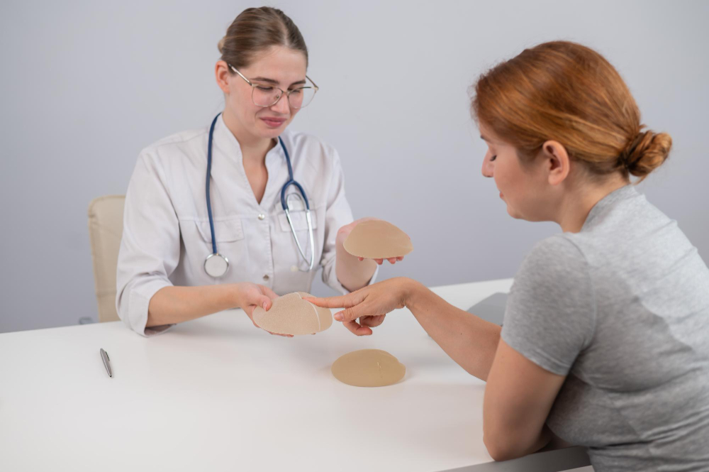 Doctor consulting woman for breast augmentation and implant selection at Morph Aesthetic Clinic Ahmedabad