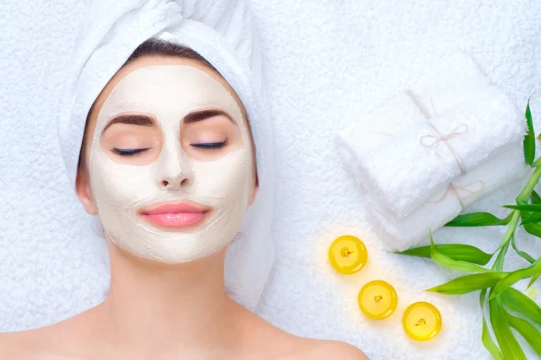 Woman relaxing with a medical-grade facial mask applied to her skin.